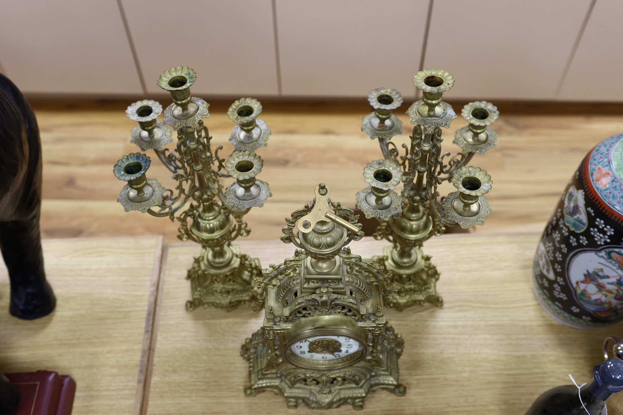 A French brass clock garniture c.1900, Japy Freres movement. 48cm high